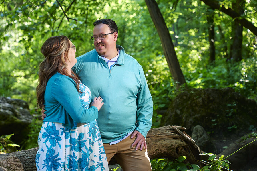 Kimberly and Stephen embracing in the woods