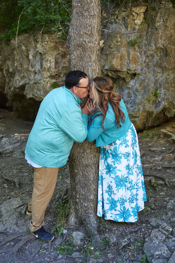 Kimberly and Stephen leaning against a tree